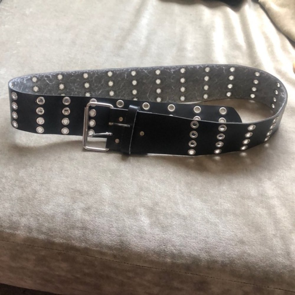 Black belt with silver eyelets